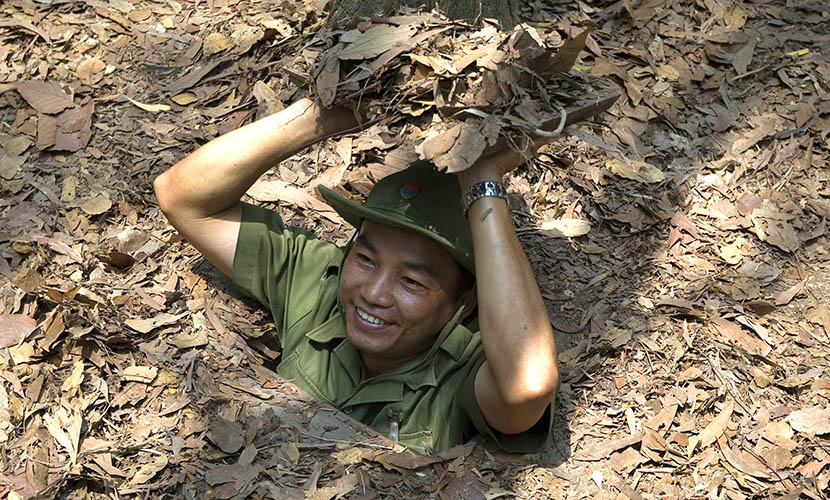 a man at cu chi tunnel